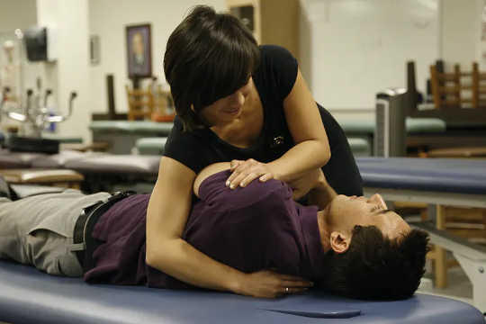 An osteopathic medical student practices an adjustment that is part of osteopathic manipulative treatment.